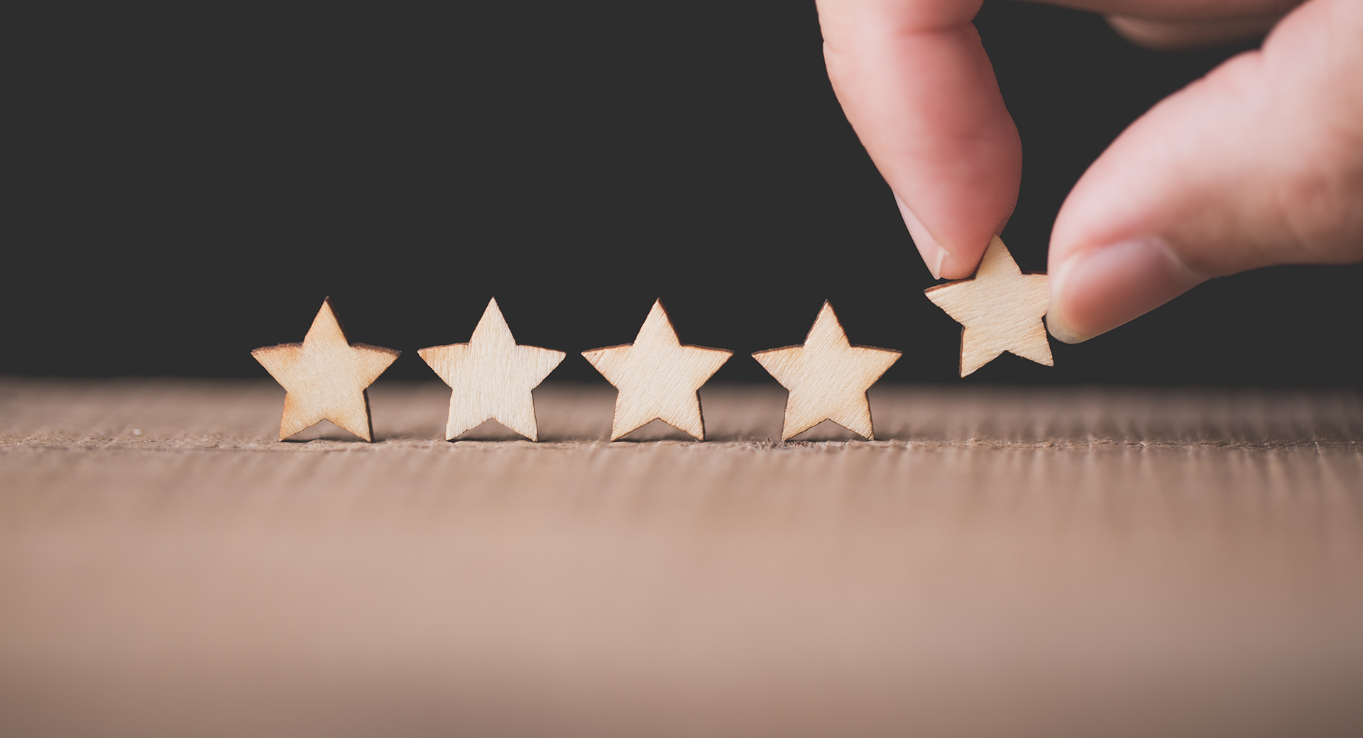 5 wooden stars placed on a table