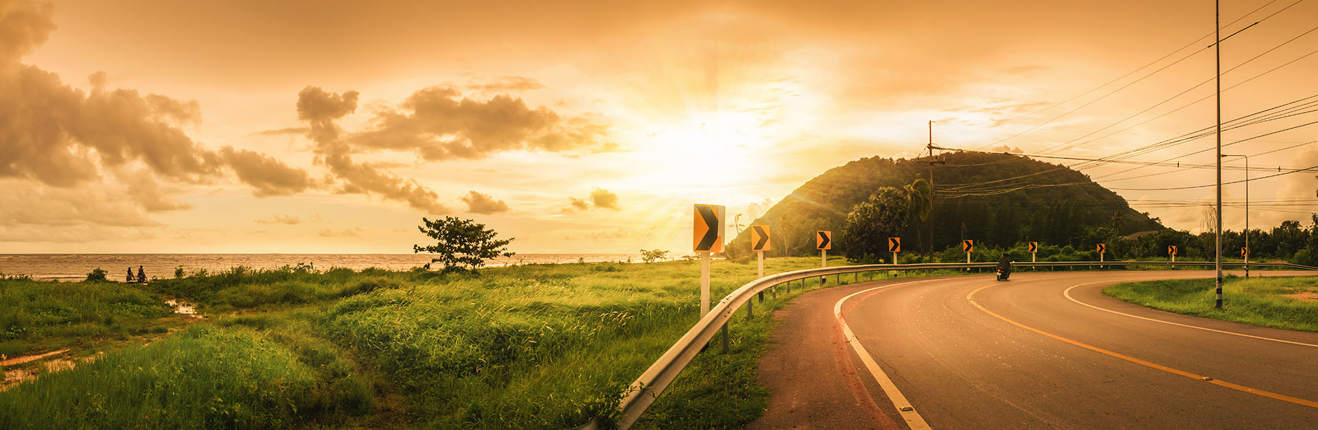 scenic view of a motorcycle on a curved road 